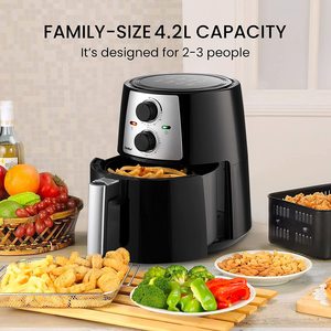 COMFEE' Air Fryer next to fried food.