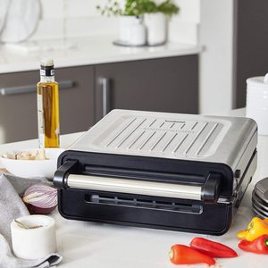 George Foreman 28000 Smokeless Electric Grill in a closed position.