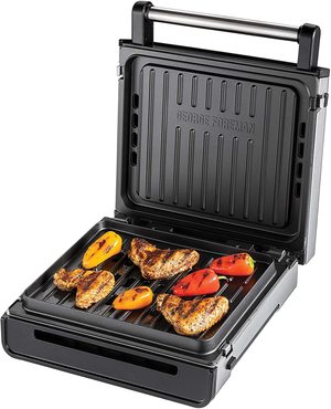 George Foreman 28000 Smokeless Electric Grill in use.