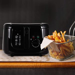 LIVIVO Deep Fat Fryer next to fried food.