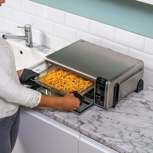 Ninja Foodi 8-in-1 Flip Mini Oven in use.