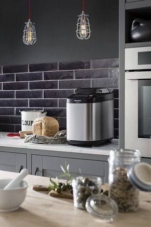 Panasonic SD-ZB2502BXC Stainless Steel Bread Maker in a kitchen.