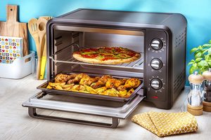 Tefal OF445840 Optimo Mini Oven in use.