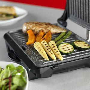 Tower Large Cerastone Health Grill in use.